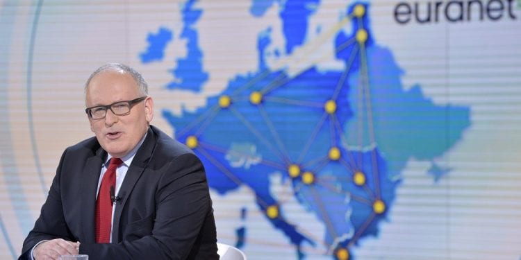 Timmermans: Wspierając Polskę spłacam swój moralny dług