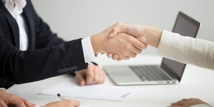 Hr handshaking successful candidate getting hired at new job, closeup